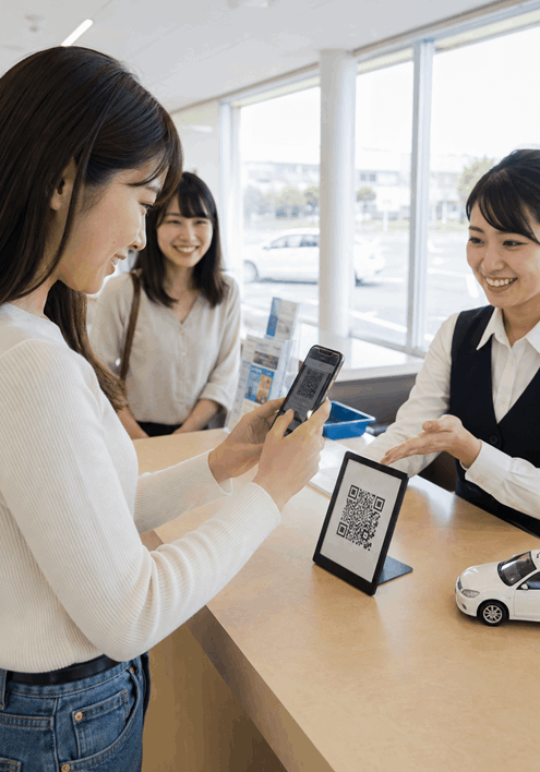 自動車教習所の受付窓口でQRコードから必要書類を案内